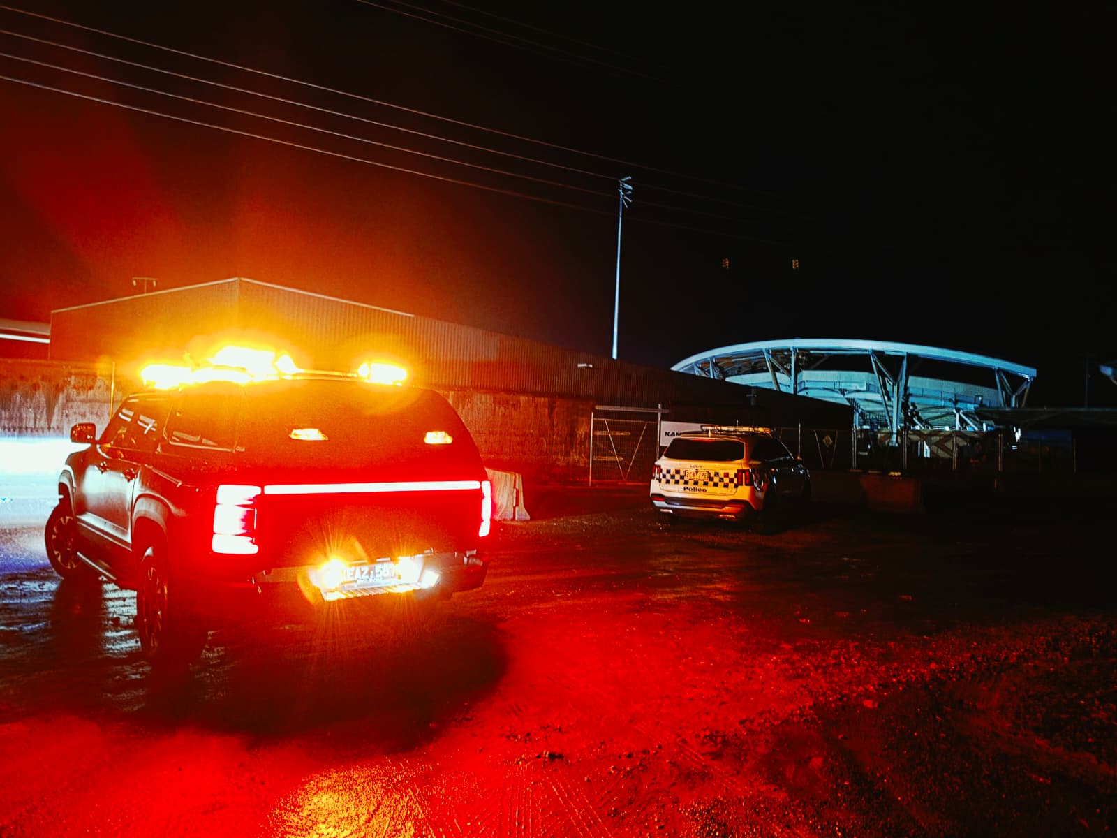 ZPS patrol vehicle attending a site at night alongside police